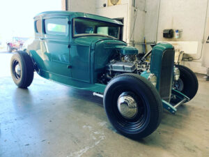 green vintage vehicle with no hood to show off engine Arizona Driveshaft & Differential Mesa Arizona