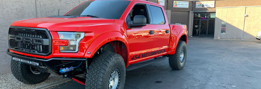 red Ford truck has driveshaft and differential installed Arizona Driveshaft & Differential Mesa Arizona