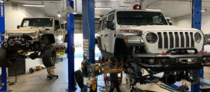 two Jeeps getting their off roading differentials and driveshafts installed Arizona Driveshaft & Differential Mesa Arizona