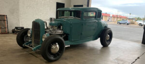 classic restored green vehicle shows off it's engine Arizona Driveshaft & Differential Mesa Arizona